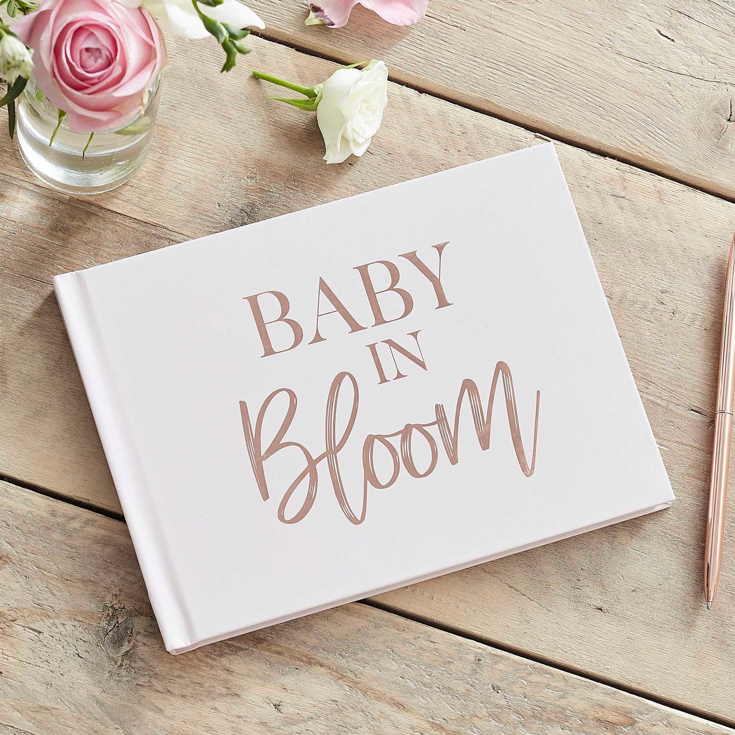 Rose gold and powder-colored baby shower guestbook