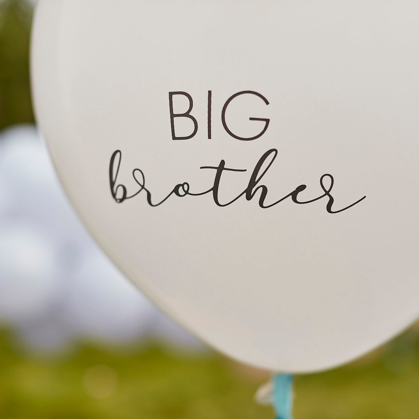 Ballon Big Brother avec pompons bleus 